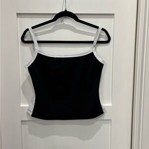 White fox tank top with black front and white sides. Never worn